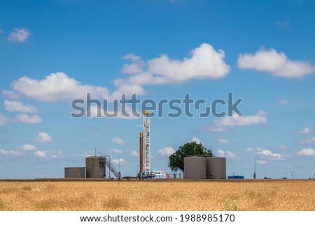 Drilling rig and storage tanks in Permian Basin