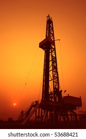 Drilling Rig At Sunset