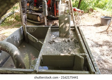 Drilling Rig For Drilling Water Wells And Producing Drinking Water For Residential Premises. Pumping Dirty Water Out Of The Well