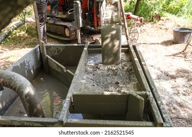 Drilling Rig For Drilling Water Wells And Producing Drinking Water For Residential Premises. Pumping Dirty Water Out Of The Well