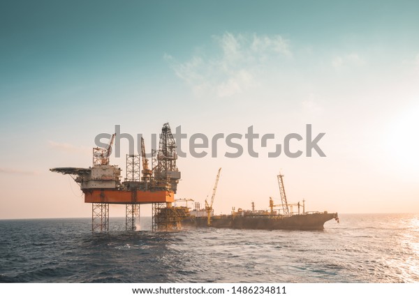 Drilling rig, wellhead platform,\
floating production storage offloading (FPSO) at oil\
field