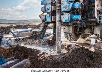 A drilling rig is working on a site. Deep hole drilling. Geological exploration work. Mineral exploration. Powerful drill drills a well - Shutterstock ID 2047393454