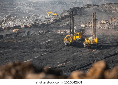 Drilling Rigs Borer Drill Wells For Installing Cast Explosives Blasting. Open Mine Coal And Minerals From Bowels Soil Explosion.