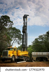 Drilling a water well on country land. Modern rotary drill rigs bore water well.