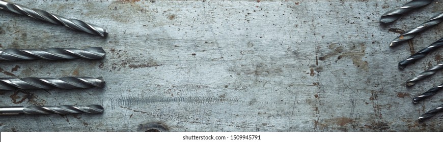 Drills For Drilling Metal, Laid Out On A Textured Steel Bench Metal Sheet. Top View With Copy Space. Flat Lay