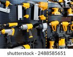 Drills and screwdrivers are sold in the power tool store. Showcase with power tool drills