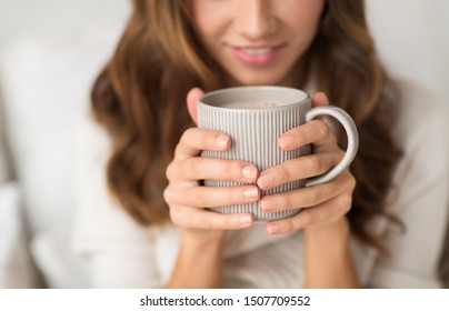 Drink, Christmas And Hygge Concept - Close Up Of Happy Woman With Cup Of Coffee At Home