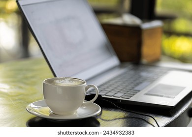 Drink coffee while working on a casual day.