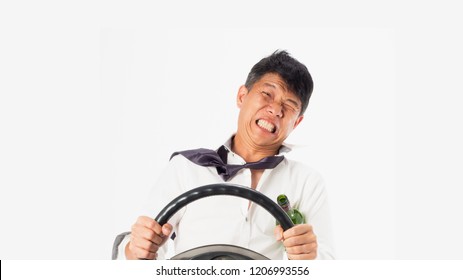 Drink Don't Drive Concepts.Drunk Asian Business Man Wear White Shirt Holding Wine Bottle And Steering Wheel On  Isolated White Background