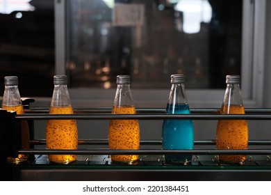 Drink factory production line fruit juice beverage product at conveyor belt. - Shutterstock ID 2201384451