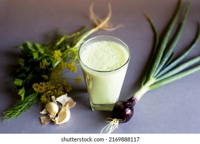 Drink In A Glass. Green Smoothie With Yogurt Or Kefir. The Composition Is Supplemented With Herbs, Onions, Garlic.