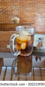  Drink Half Ice Tea With Empty Plate Behind.