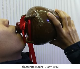 A Drink For The Man. Cropped Closeup Of A Man Drinking Chinese White Whiskey (White Whiskey In Chinese Call Baijiu) 