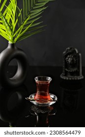 Drink on Black Deep Background with Leaf Decoration