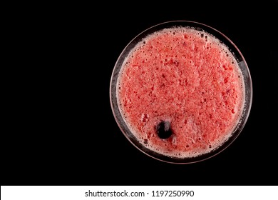 Drink , Pink Slush Ice Cold Summer Drink With Cherry On Top. Top View Isolated On Black Background