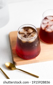 Drink Pouring Coffee Tonic With Raspberry Syrup White Styling Sideways