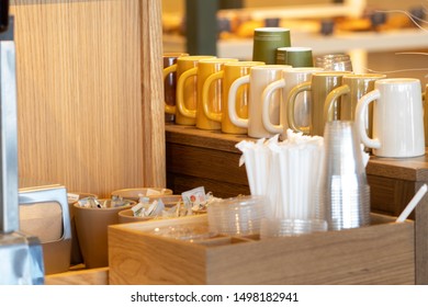 Drink Station With Coffee Mugs Lids Straws Sugar And Condiments