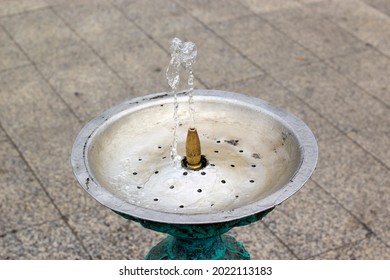 Drink Water Fountain Outdoor In A Park. Water Streaming From Metallic Drinking Fountain. Nobody. No People. Concept Image.