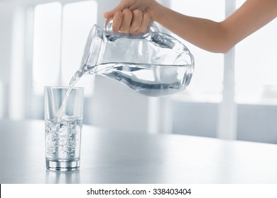 Drink Water. Woman's Hand Pouring Fresh Pure Water From Pitcher Into A Glass. Health And Diet Concept. Healthy Lifestyle. Healthcare And Beauty. Hydratation. - Powered by Shutterstock