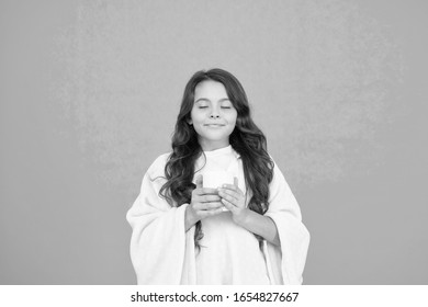 Drink Well, Live Well. Little Girl Drink Cocoa Or Milk Before Sleeping. Cosy And Fluffy Pajama. Feeling Comfortable At Home. Happy Girl With Tea Cup. Good Morning Drink. Small Kid Blue Background.