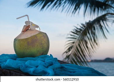 Drinking coconut and blue cloth on the beach, Koh Samui, Thailand.