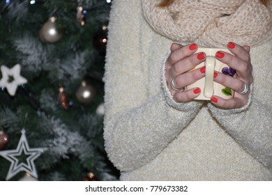 Drinking coffee in front of Christmas tree