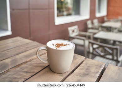 Drinking Coffee In Outdoor Cafe. Tasty Latte In Mug. Lunch Casual Atmosphere. Standing Beverage. Lifestyle Cozy Morning. No People. Hotel Breakfast