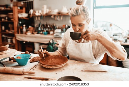 Drinking coffee, pottery and creative woman in workshop for carving pattern or design with ribbon tools. Artist, equipment and person sculpting ceramic for art, shape and decoration for manufacturing - Powered by Shutterstock