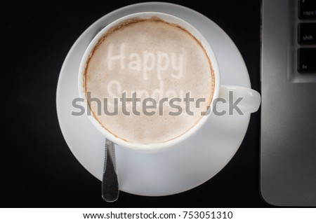 Drinking coffee and using laptop