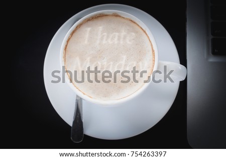 Drinking coffee and using laptop monday