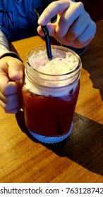 Drinking cold drinks with a drinking straw