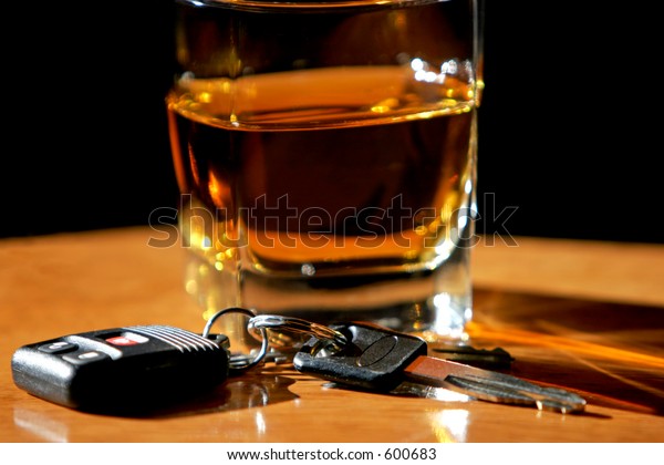 Drinking and Driving - Car keys and alcohol\
(shallow focus).