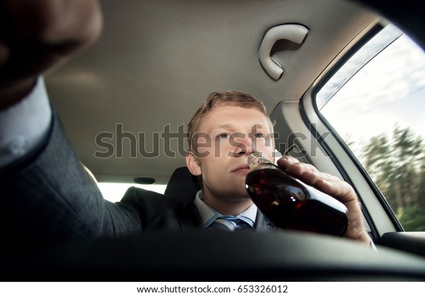 Drinking and driving a\
car while driving