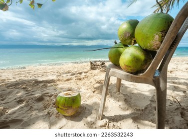 For drinking healthy coconut water. In the shade on a lazy tropical beach in the Philppines islands,with white,fine sand,clear blue sea,palm trees,clean,un-polluted,serene,idyllic and relaxing.