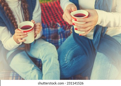 Drinking Tea Or A Cup Of Tea. Hands Woman And Child Holding Cup Tea