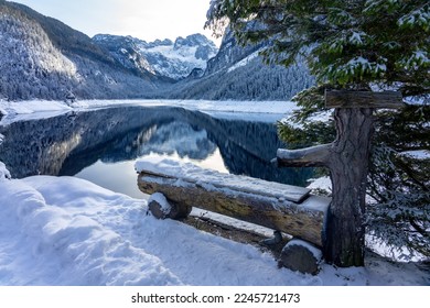 drinking trough next to beautiful snowy winter landscape with Dachstein mountain and Gosausee in Austria near Hallstatt . - Shutterstock ID 2245721473