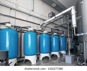 Drinking Water Factory Or Plant Production, Industrial Interior. Large Metal Tanks For Filtering And Potable Water Treatment From Well.