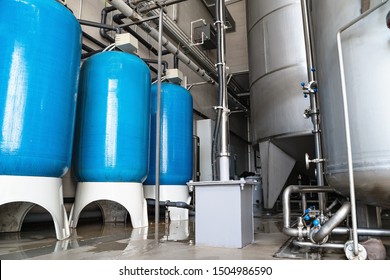 Drinking Water Factory Or Plant Production, Industrial Interior. Large Metal Tanks For Filtering And Potable Water Treatment From Well.