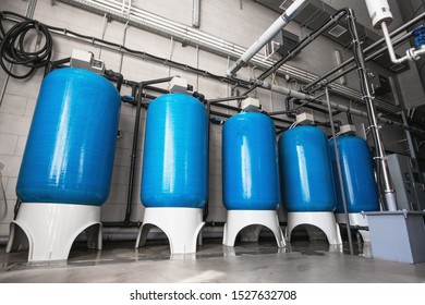 Drinking Water Factory Or Plant Production, Industrial Interior. Large Metal Tanks For Filtering And Potable Water Treatment From Well.