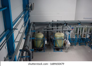 Drinking Water Factory Or Plant Production, Industrial Interior. Large Metal Tanks For Filtering And Potable Water Treatment From Well.