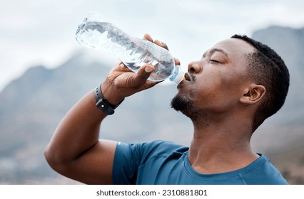 Drinking water, fitness and black man in nature for exercise, marathon training and running outdoors. Sports, workout and thirsty male person rest to drink liquid for hydration, wellness and health - Powered by Shutterstock