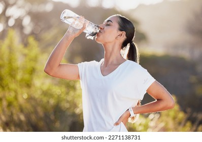 Drinking water, fitness and exercise woman after sports run and training in nature. Workout, hiking and walking challenge with a bottle of a female runner in summer ready for running for health - Shutterstock ID 2271138731