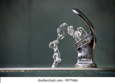 Drinking Water Flowing From A Fountain