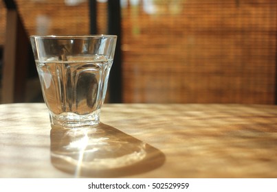 Drinking Water In A Glass With Caustic Light.