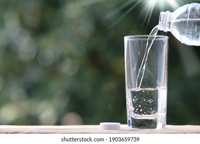 Drinking water on wood table and space for text