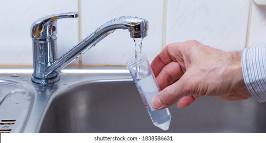 Drinking water in the test tube for chemical and microbiological analysis - Shutterstock ID 1838586631