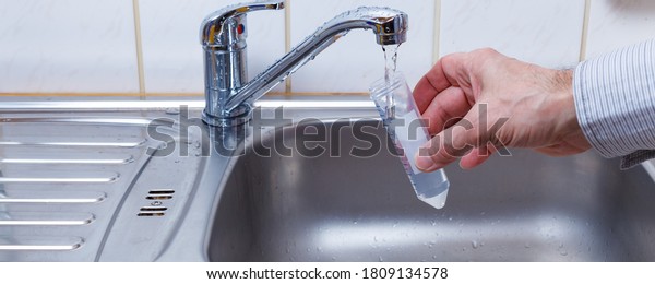 Drinking water in the test tube for chemical and\
microbiological\
analysis