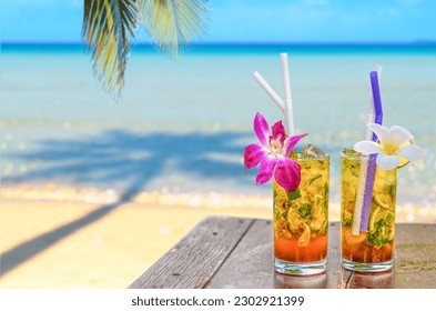 drinks with blur beach and sunset in background - Powered by Shutterstock