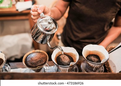 Drip brewing, filtered coffee, or pour-over is a method which involves pouring water over roasted, ground coffee beans contained in a filter. - Shutterstock ID 473186926