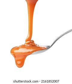drip of caramel in a spoon on a white background - Shutterstock ID 2161852007